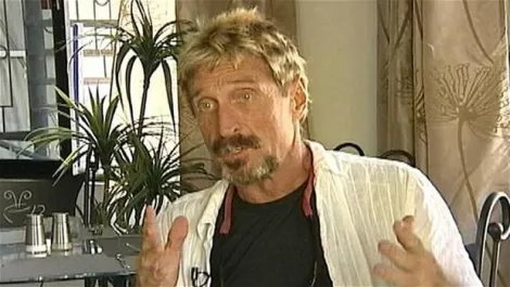 McAfee founder seeking asylum